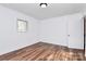 This room has new floors and bright light from a window at 2548 Milton Ave, Gastonia, NC 28052