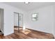 Bright bedroom features new laminate flooring, and a mirrored sliding door closet at 2548 Milton Ave, Gastonia, NC 28052