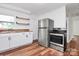Modern kitchen with stainless steel appliances, white cabinetry, and butcher block countertops at 2548 Milton Ave, Gastonia, NC 28052