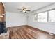 Bright living room showcasing hardwood floors, a fireplace, and a large window with natural light at 2548 Milton Ave, Gastonia, NC 28052