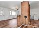 Spacious living room with new laminate flooring, white walls, and brick accents at 2548 Milton Ave, Gastonia, NC 28052
