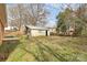 A weathered outbuilding or garage with a swing nearby at 2548 Milton Ave, Gastonia, NC 28052
