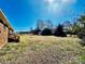 Spacious backyard of a brick house with trees, perfect for outdoor activities and Gathering gatherings at 2604 Oxford Cir, Lancaster, SC 29720
