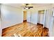 Bright bedroom featuring hardwood floors, closet, and ceiling fan at 2604 Oxford Cir, Lancaster, SC 29720