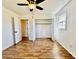Cozy bedroom featuring hardwood floors, a ceiling fan, closet, and a sunny window at 2604 Oxford Cir, Lancaster, SC 29720