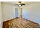 Bright bedroom featuring hardwood floors, closet, and ceiling fan at 2604 Oxford Cir, Lancaster, SC 29720