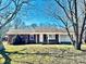 Charming brick home featuring a well-maintained lawn and a welcoming front entrance at 2604 Oxford Cir, Lancaster, SC 29720