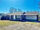 Charming brick ranch-style house with an attached carport and white trim with a well manicured yard at 2604 Oxford Cir, Lancaster, SC 29720