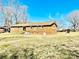 Rear exterior of a brick home with a large backyard and plenty of space for outdoor activities at 2604 Oxford Cir, Lancaster, SC 29720