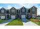 Charming townhomes feature stone accents, individual garages, and well-manicured lawns at 3160 Ora Smith Rd, Lincolnton, NC 28092