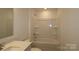 Bright bathroom featuring a tub-shower combo and a vanity with granite countertops at 3511 Nimbell Rd, Monroe, NC 28110