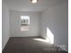 Cozy bedroom featuring neutral carpet and a window with natural light at 3511 Nimbell Rd, Monroe, NC 28110