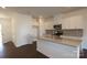 Modern kitchen featuring white cabinets, stainless steel appliances, and a center island at 3511 Nimbell Rd, Monroe, NC 28110