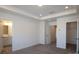 Main bedroom with a tray ceiling and doorways to an en-suite bathroom and walk-in closet at 3511 Nimbell Rd, Monroe, NC 28110