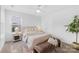 Bright bedroom with natural light, neutral colors, and comfortable furnishings at 3512 Auburn Curb Rd, Charlotte, NC 28217