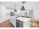 Bright kitchen with stainless steel appliances, an island with seating, and lots of cabinets at 3512 Auburn Curb Rd, Charlotte, NC 28217