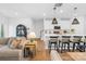 Bright and open living space flowing into a modern kitchen, creating a seamless area for entertaining and everyday living at 3512 Auburn Curb Rd, Charlotte, NC 28217