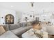 Spacious living area featuring a comfortable sofa and view to a kitchen at 3512 Auburn Curb Rd, Charlotte, NC 28217