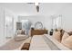 Airy main bedroom featuring a large dresser, sitting area, and ensuite bathroom at 3512 Auburn Curb Rd, Charlotte, NC 28217