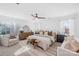 Bright main bedroom boasts neutral tones, ceiling fan, and ample natural light at 3512 Auburn Curb Rd, Charlotte, NC 28217