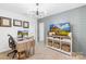 Comfortable office space with a modern desk, TV, and decorative touches at 3512 Auburn Curb Rd, Charlotte, NC 28217