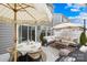 Cozy outdoor patio featuring comfortable seating and dining areas, perfect for entertaining at 3512 Auburn Curb Rd, Charlotte, NC 28217
