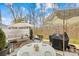 Outdoor patio with dining, seating, and grilling area at 3512 Auburn Curb Rd, Charlotte, NC 28217