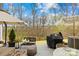 Outdoor patio with grill and seating areas; perfect for outdoor entertaining and dining at 3512 Auburn Curb Rd, Charlotte, NC 28217