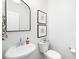 Stylish powder room featuring a modern sink and elegant decor at 3512 Auburn Curb Rd, Charlotte, NC 28217