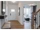 Bright entryway featuring a white door, wood floors, stylish decor, and an inviting view into the office at 3523 Rapport Ct # 026, Lancaster, SC 29720