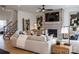 Cozy living room featuring a brick fireplace, stylish decor, and a staircase, perfect for relaxing and entertaining at 3523 Rapport Ct # 026, Lancaster, SC 29720
