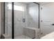 Modern shower with marble tile, a glass door, and a built-in bench at 3523 Rapport Ct # 026, Lancaster, SC 29720