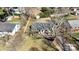 An aerial view showcases the home, its yard, and neighborhood, with mature trees at 4201 Winedale Ln, Charlotte, NC 28205