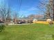 Spacious backyard with lush green grass, perfect for outdoor activities and relaxation, creating a private oasis at 4201 Winedale Ln, Charlotte, NC 28205
