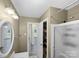 This bathroom features tile floors, vanity, shower and view into the hallway and bedroom at 4201 Winedale Ln, Charlotte, NC 28205