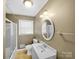 Bathroom includes a shower with white vanity and sink at 4201 Winedale Ln, Charlotte, NC 28205