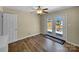 Bedroom featuring laminate flooring, neutral walls, and glass doors to the backyard at 4201 Winedale Ln, Charlotte, NC 28205