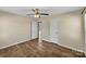 This bedroom features hardwood floors, neutral walls, and a ceiling fan with light fixture at 4201 Winedale Ln, Charlotte, NC 28205