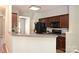This kitchen shows dark wood cabinetry and modern black appliances at 530 Pate Dr, Fort Mill, SC 29715