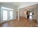 Open floor plan showcasing wood floors connecting the living room, dining and kitchen at 530 Pate Dr, Fort Mill, SC 29715