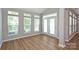 Bright sunroom with lots of windows, wood floors, and access to the backyard at 530 Pate Dr, Fort Mill, SC 29715