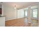 Open-concept living area with ample windows, wood floors, and great natural light at 530 Pate Dr, Fort Mill, SC 29715