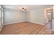 Bright living room features beautiful wood floors and a contemporary ceiling fan at 530 Pate Dr, Fort Mill, SC 29715