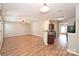 Open-concept living room flows to the kitchen with wood floors at 530 Pate Dr, Fort Mill, SC 29715