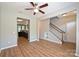Spacious living area featuring wood floors, a ceiling fan, and a staircase at 530 Pate Dr, Fort Mill, SC 29715