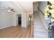 Spacious living area with wood floors, a ceiling fan and a staircase at 530 Pate Dr, Fort Mill, SC 29715