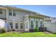 Back of the house with a patio area, windows, and green space, creating a private outdoor setting at 530 Pate Dr, Fort Mill, SC 29715