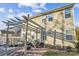 Outdoor patio and backyard featuring a pergola, grill, and cozy seating area at 558 Rough Hewn Ln, Rock Hill, SC 29730
