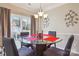 Cozy dining area featuring a glass table, stylish chairs and sliding glass doors at 558 Rough Hewn Ln, Rock Hill, SC 29730