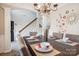 Dining room with wood table, seating for six, decorative wall art, and chandelier at 558 Rough Hewn Ln, Rock Hill, SC 29730